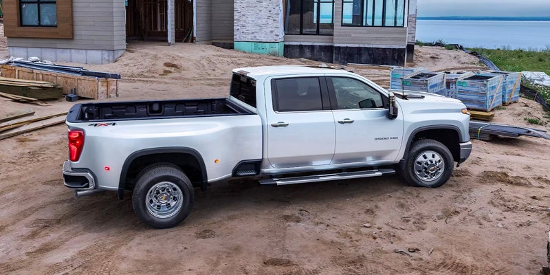 White Chevrolet Silverado-HD parked outside next to a construction site